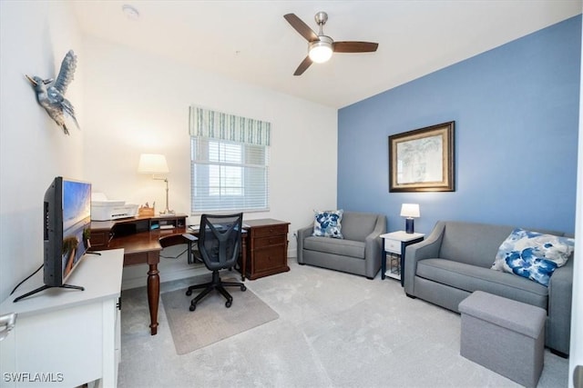 office featuring ceiling fan and light carpet