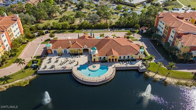 birds eye view of property with a water view