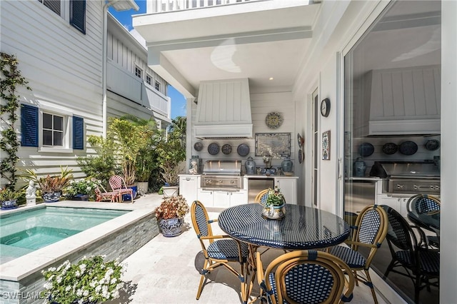 view of patio featuring outdoor dining area, a hot tub, and grilling area