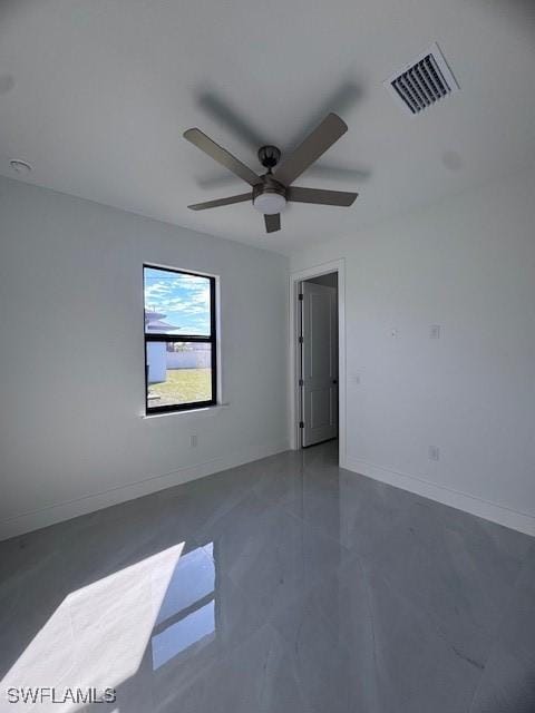 spare room with ceiling fan