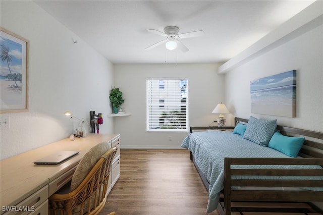 bedroom featuring dark hardwood / wood-style flooring and ceiling fan