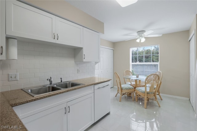 kitchen with sink, ceiling fan, backsplash, white dishwasher, and white cabinets