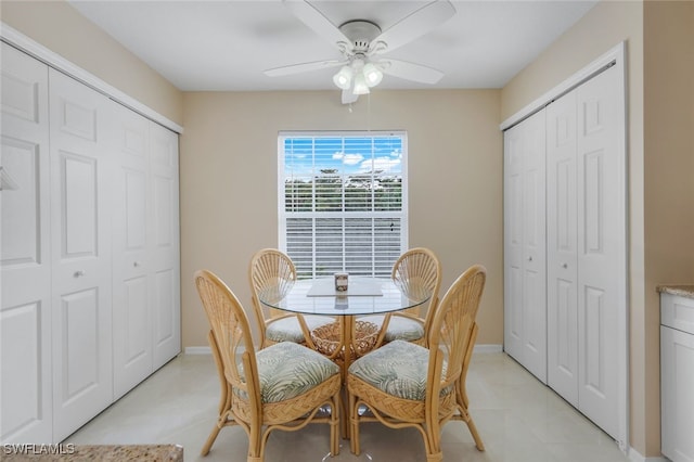 tiled dining area featuring ceiling fan