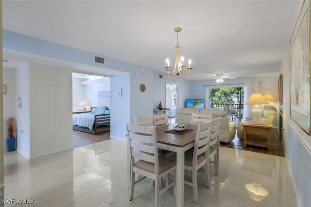 dining space with a notable chandelier