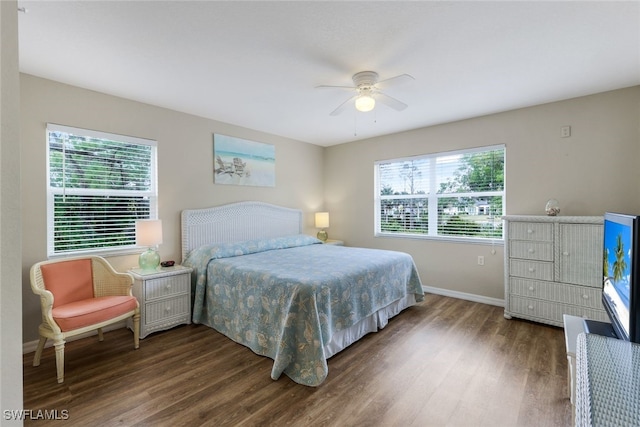 bedroom featuring dark wood-type flooring and ceiling fan