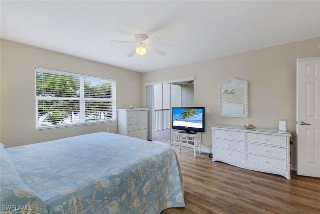 bedroom with dark wood-type flooring and ceiling fan