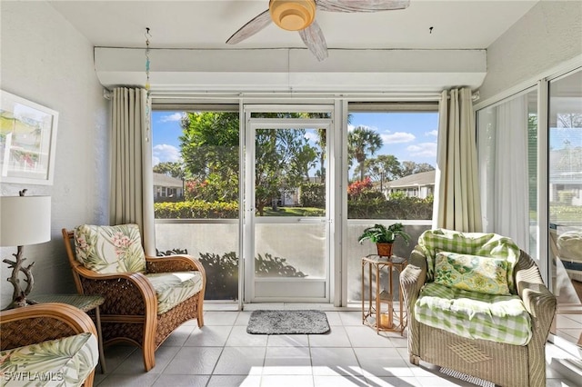 sunroom featuring ceiling fan