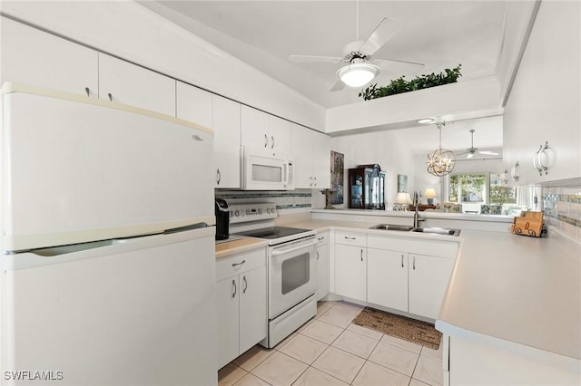 kitchen featuring sink, white appliances, white cabinets, light tile patterned flooring, and kitchen peninsula