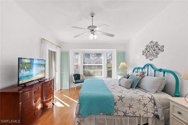 bedroom featuring ceiling fan and light hardwood / wood-style flooring