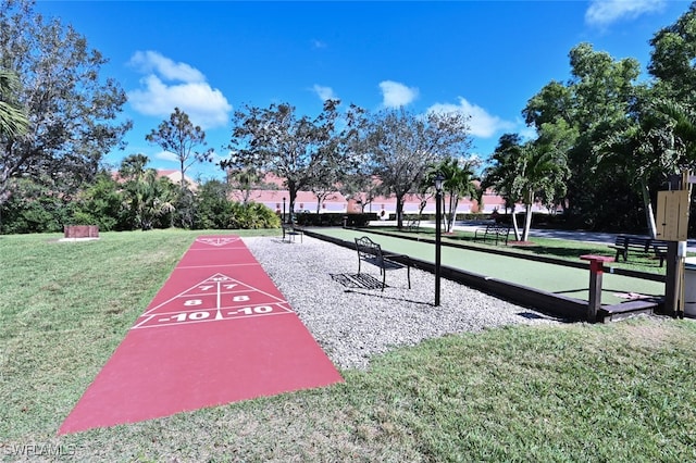 view of home's community featuring a yard