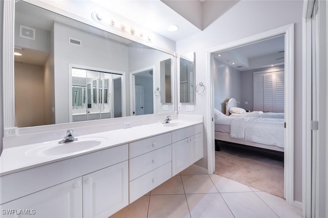 bathroom featuring tile patterned floors and vanity