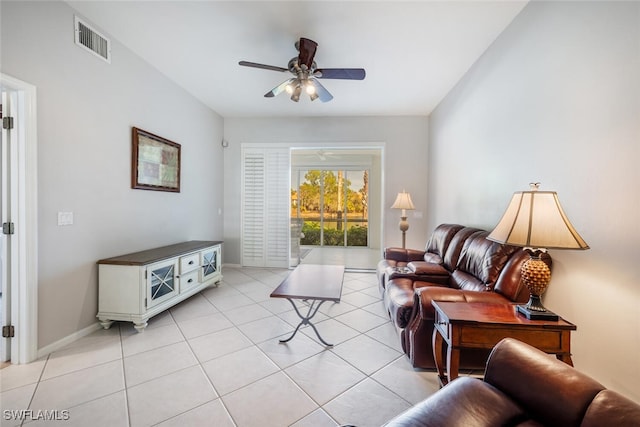 tiled living room with ceiling fan