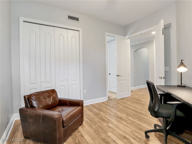 home office with light wood-type flooring