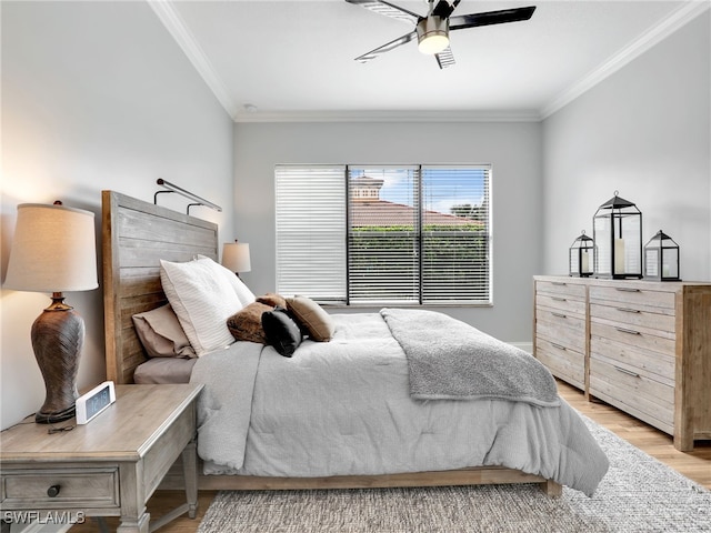 bedroom featuring crown molding, ceiling fan, and light hardwood / wood-style floors