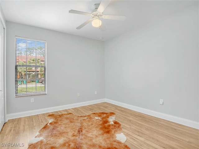 empty room with wood-type flooring and ceiling fan