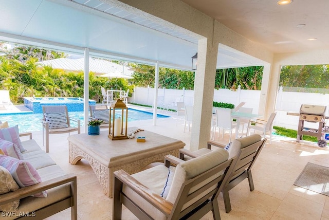 view of patio featuring a fenced in pool, a grill, and an outdoor living space