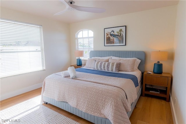 bedroom with hardwood / wood-style floors and ceiling fan