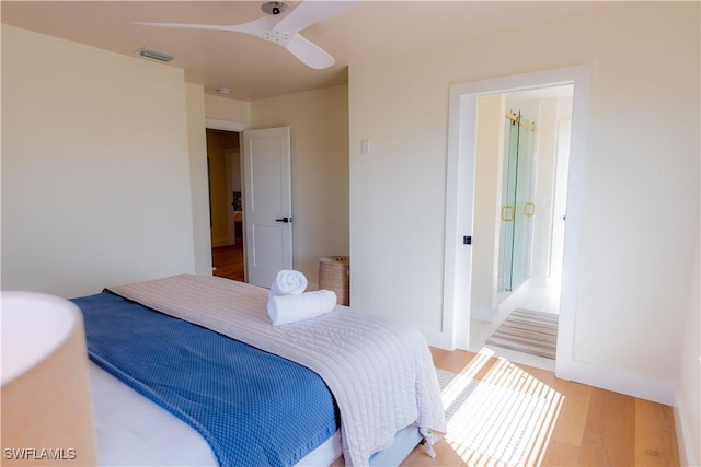 bedroom featuring hardwood / wood-style floors and ceiling fan