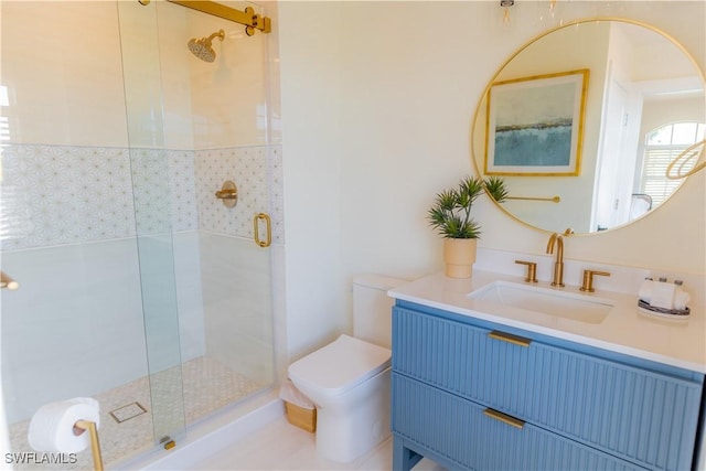 bathroom with vanity, an enclosed shower, and toilet