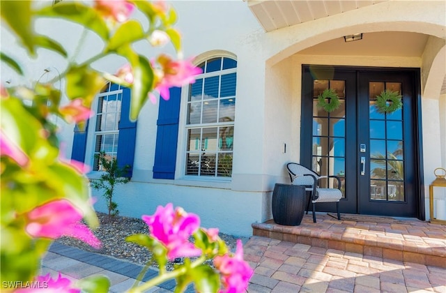 entrance to property featuring french doors