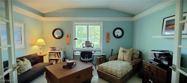 living area with lofted ceiling and light tile patterned floors