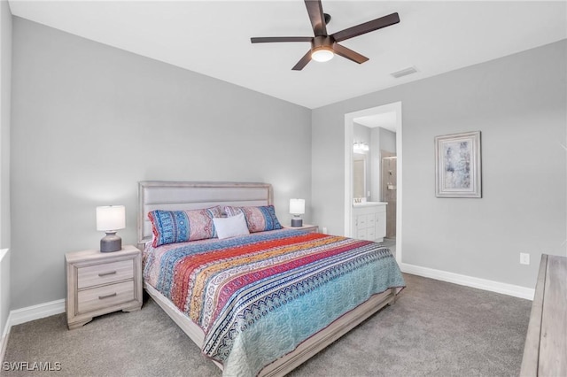 bedroom featuring ceiling fan, ensuite bathroom, and carpet floors