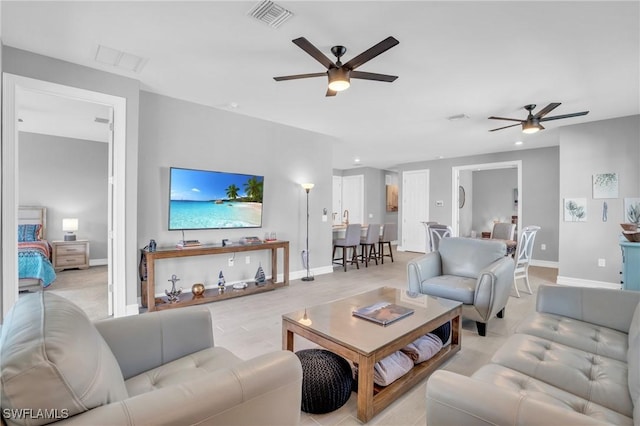 living room with ceiling fan