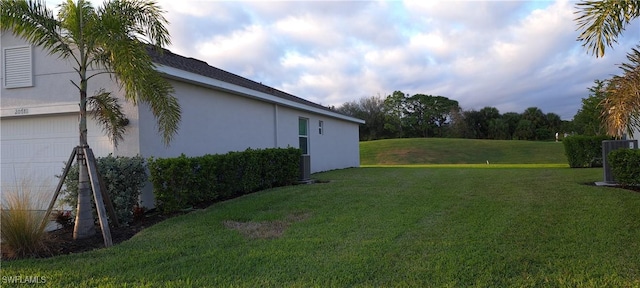 view of yard with a garage