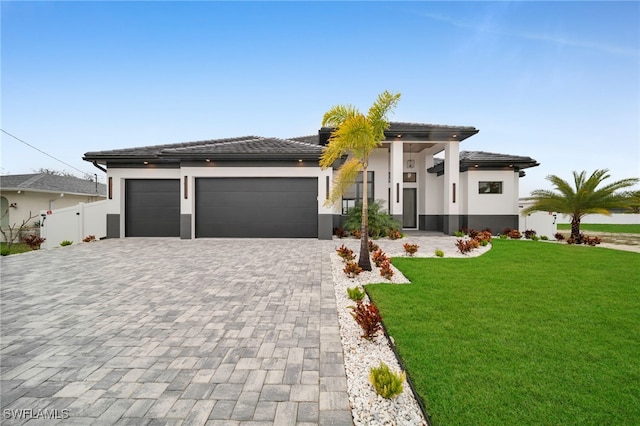 prairie-style house with a garage and a front yard