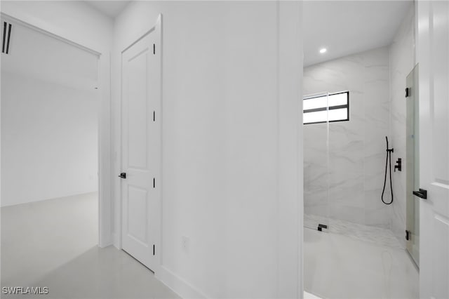 bathroom with a shower with shower door