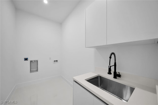 laundry area featuring cabinets, electric dryer hookup, sink, and washer hookup