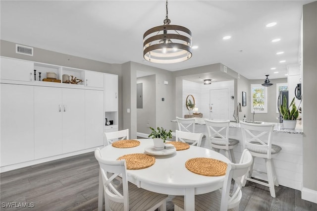11041 Gulf Reflections Dr Unit 203, Fort Myers, FL 33908 - dining room featuring an inviting chandelier, dark hardwood / wood-style flooring, and electric panel