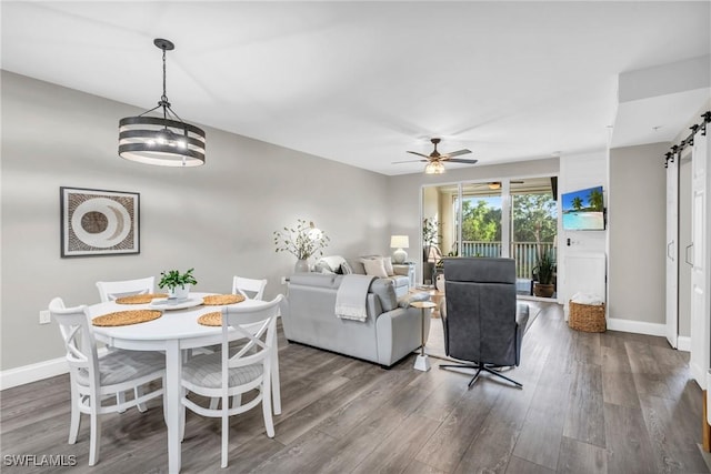 11041 Gulf Reflections Dr Unit 203, Fort Myers, FL 33908 - living room with a barn door, hardwood / wood-style floors, and ceiling fan