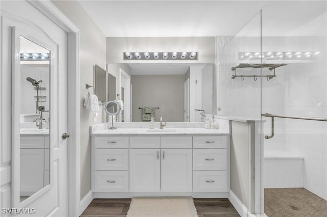 11041 Gulf Reflections Dr Unit 203, Fort Myers, FL 33908 - bathroom featuring vanity, wood-type flooring, and an enclosed shower