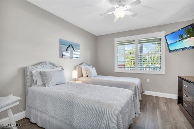 11041 Gulf Reflections Dr Unit 203, Fort Myers, FL 33908 - bedroom featuring ceiling fan and light wood-type flooring