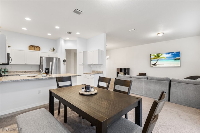 view of carpeted dining room