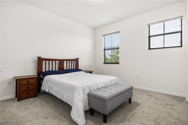 bedroom with light colored carpet