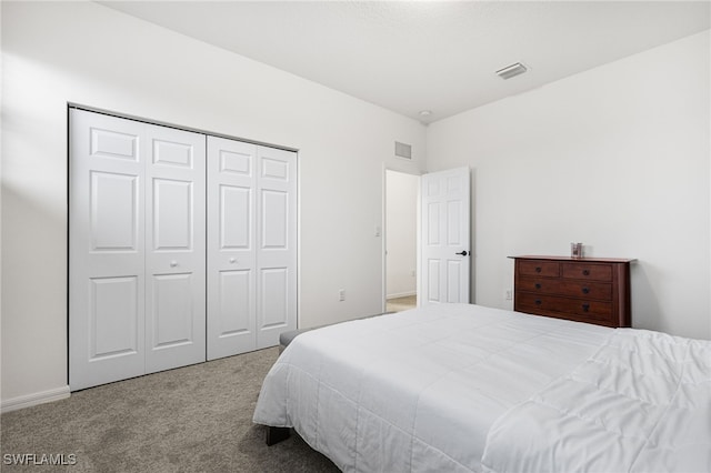 bedroom featuring light carpet and a closet