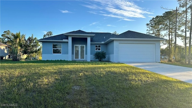 view of front facade featuring a garage and a front yard