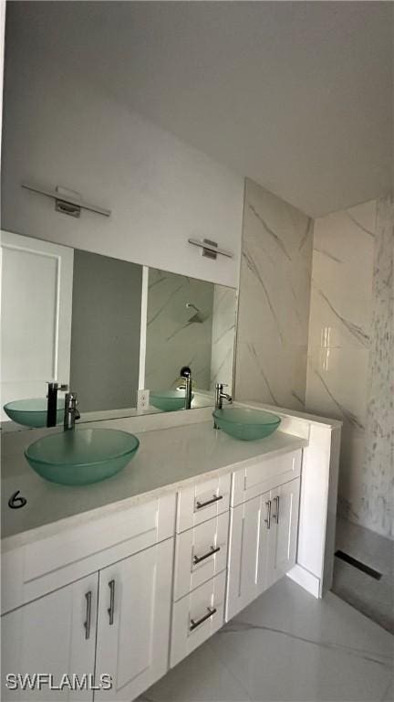 bathroom with vanity and tile patterned flooring