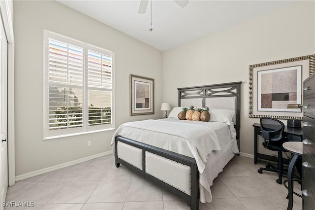 tiled bedroom with a closet and ceiling fan