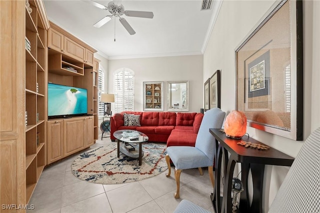 tiled living room with crown molding and ceiling fan