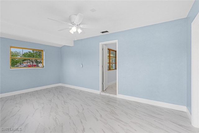 spare room featuring ceiling fan