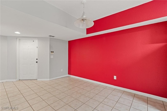 empty room with tile patterned flooring