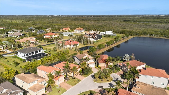 drone / aerial view with a water view and a residential view