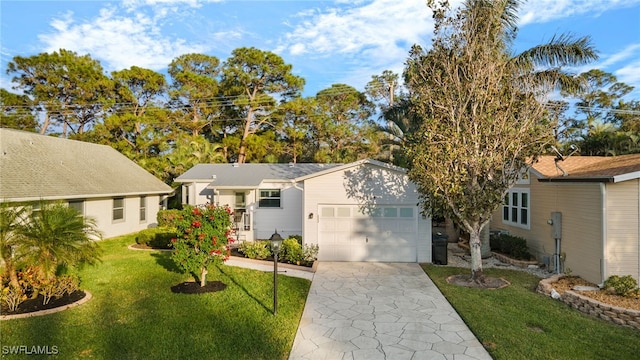 view of front facade with a garage and a front yard