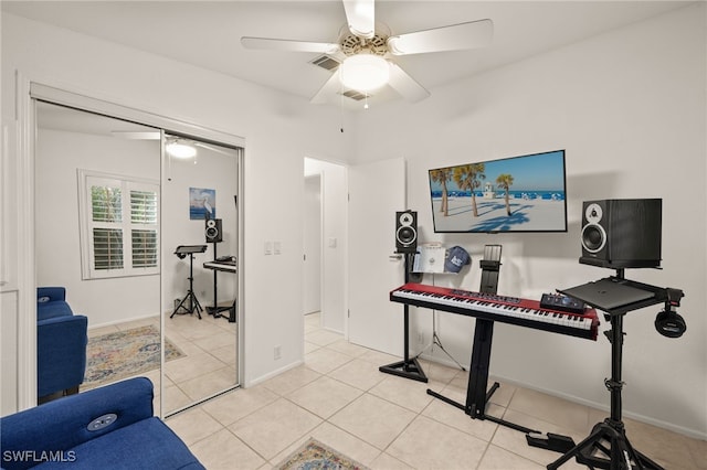 miscellaneous room featuring light tile patterned flooring and ceiling fan