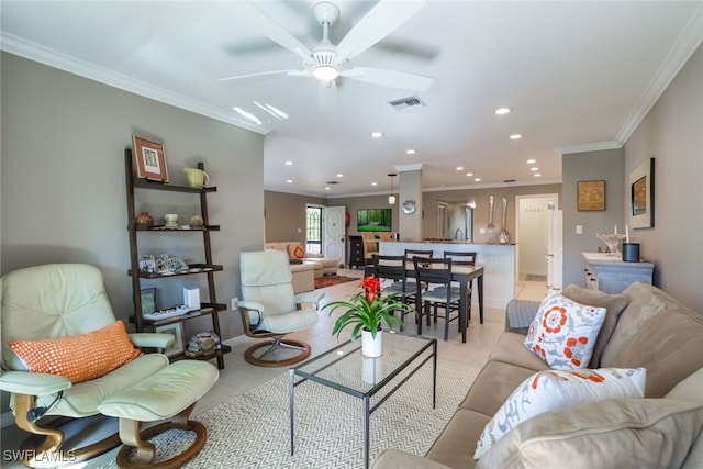 living room featuring crown molding and ceiling fan