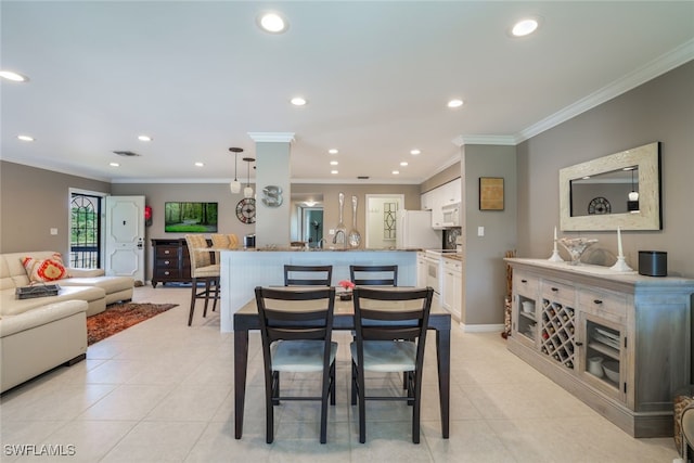 tiled dining room with ornamental molding