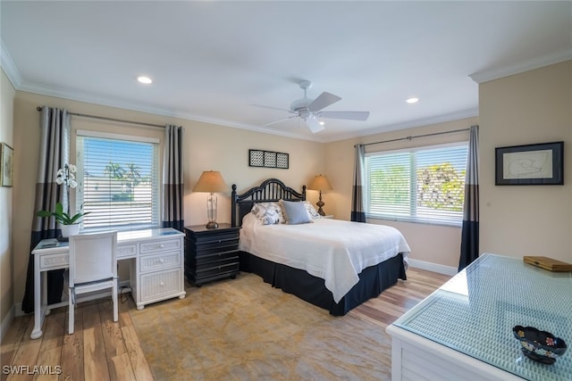 bedroom featuring ornamental molding, light hardwood / wood-style flooring, and ceiling fan